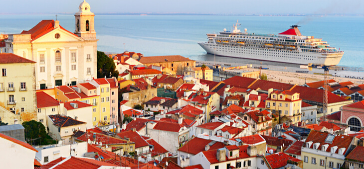 cruise ship docked in bay of european city