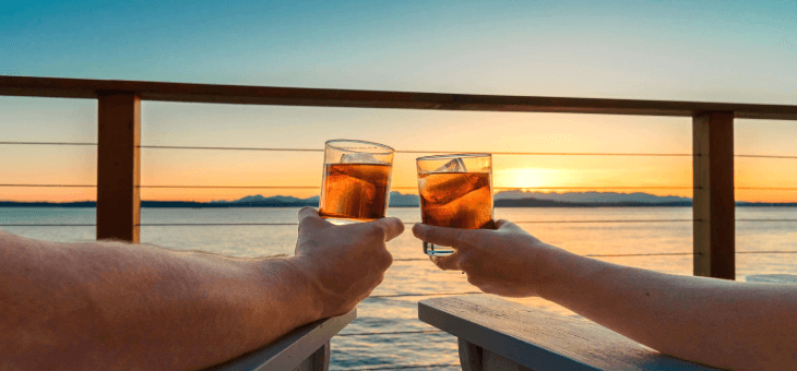 A couple watching the sunset on a cruise