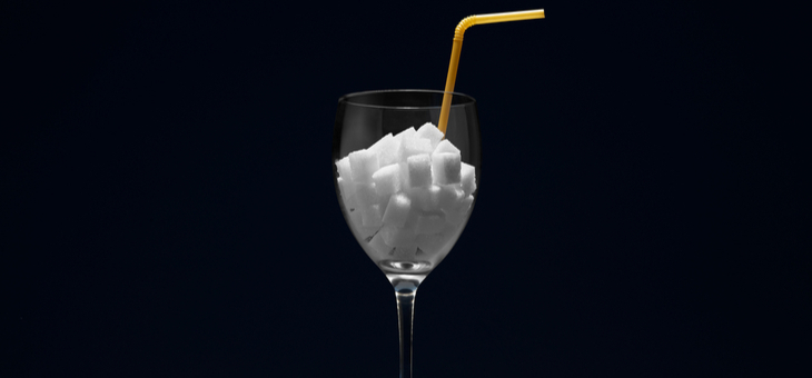 wine glass half filled with sugar cubes