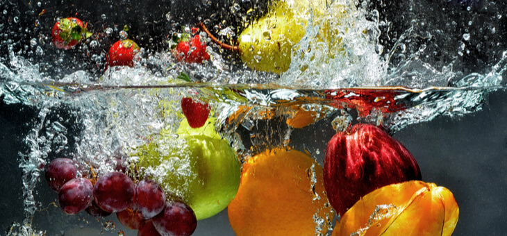 various fruits and vegetables dropped in water