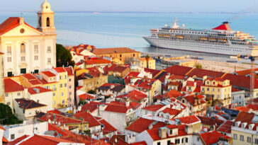 cruise ship docked in bay of european city