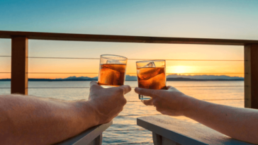 A couple watching the sunset on a cruise