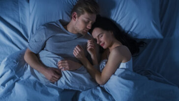 couple sleeping peacefully in bed