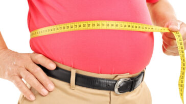 overweight man with tape measure around belly
