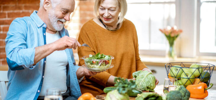 older couple preparing vegetables older couple preparing vegetables