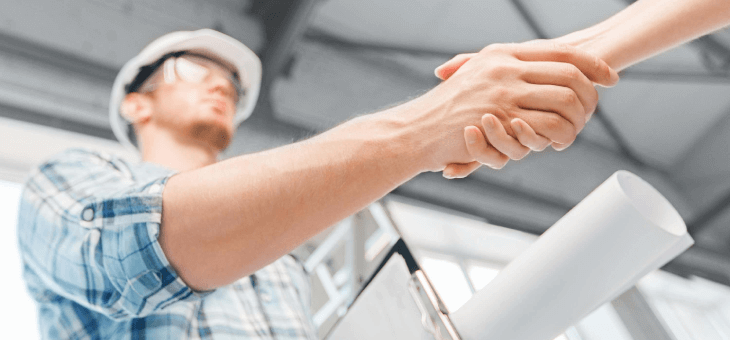 tradesman shaking hands