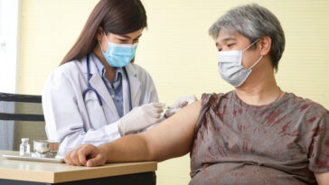 overweight woman receiving covid vaccine