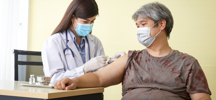 overweight woman receiving covid vaccine
