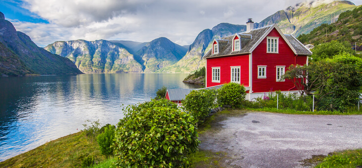 quaint house by fjord in norway