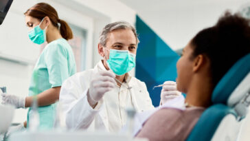 dentist in surgery talking to patient