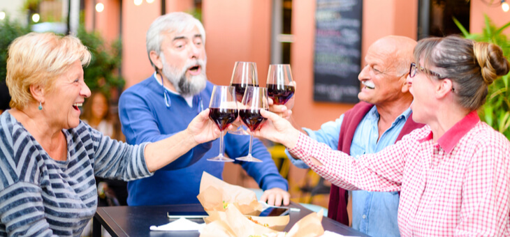 group of older people drinking wine