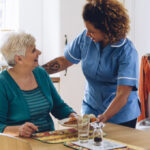 elderly woman receiving home care from nurse