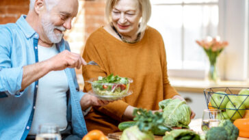 older couple preparing vegetables