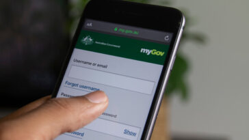 person logging into mygov on phone