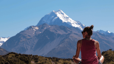 Woman admiring New Zealand mountain view