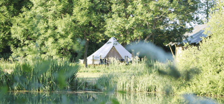 Tent in a beautiful, lush green English landscape