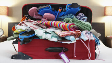 suitcase overfilled with clothes