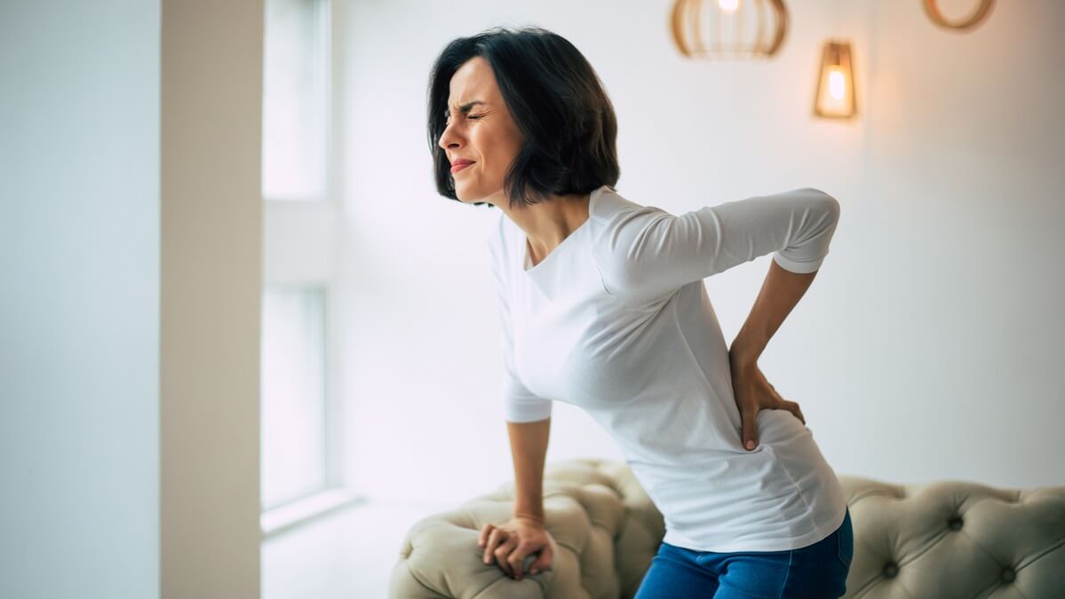 woman experiencing lower back pain