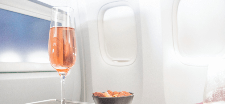 Picture of a glass of wine on a flight