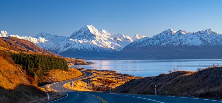 highway winding through scenic mountains in nz