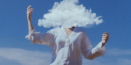 woman with head covered by clouds