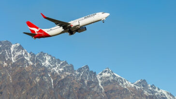 qantas plane taking off from queenstown airport