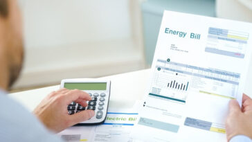 man calculating energy bill