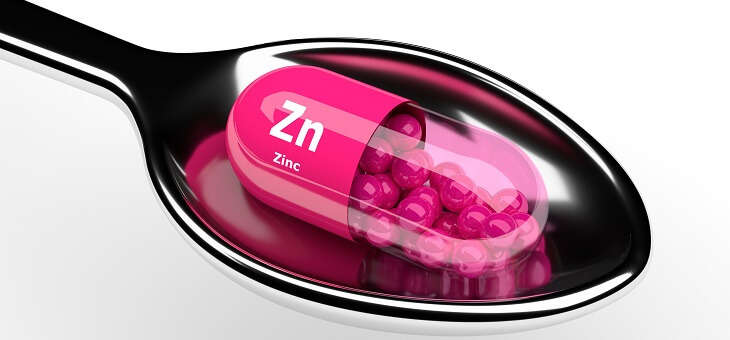 zinc capsule on a spoon
