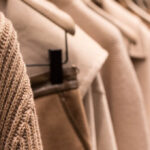 woolen coats hanging in wardrobe