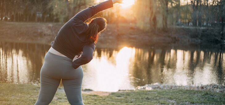 overweight woman stretching