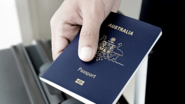 person holding australian passport