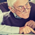 frustrated senior man using laptop
