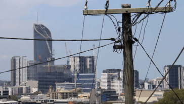 close up of power line in brisbane suburb with cbd in background