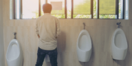 man at a urinal