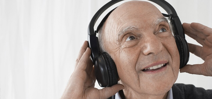 elderly man wearing headphones