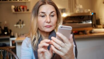 woman reading text message
