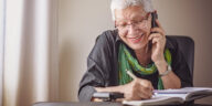 smiling woman talking on phone