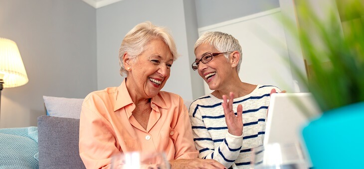 two ladies talking and laughing