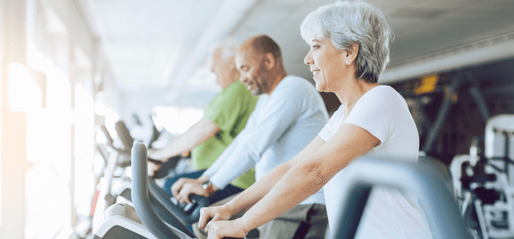 Older people on exercise bikes