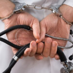 doctor in handcuffs