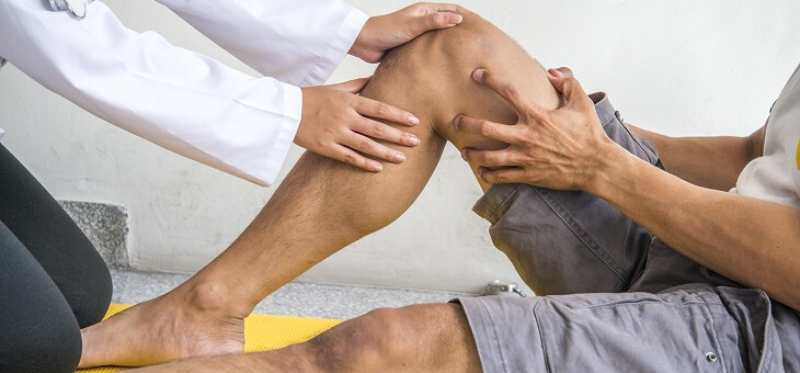 doctor treating patient's knee