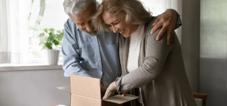 Couple opening a parcel