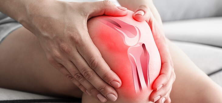 person holding sore knee