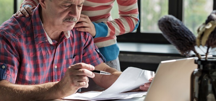older man looking at retirement income