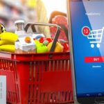 basket of supermarket goods with smartphone