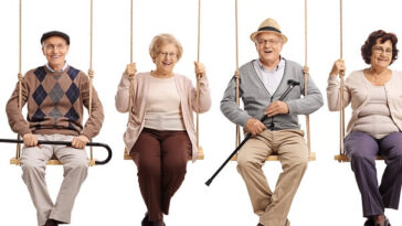 two elderly men and two elderly women on rope swings