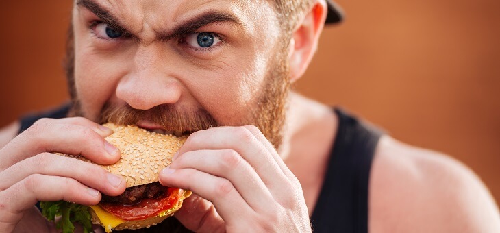 hangry man eating burger