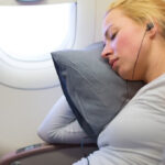 woman sleeping on a plane