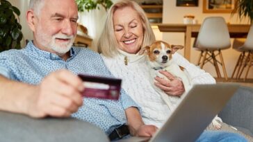 couple on couch with new seniors card