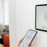 woman using smart home device